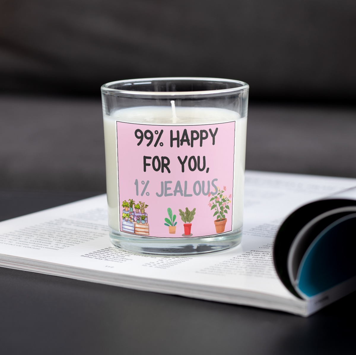 99% Happy for You 1% Jealous new home candle on an open magazine