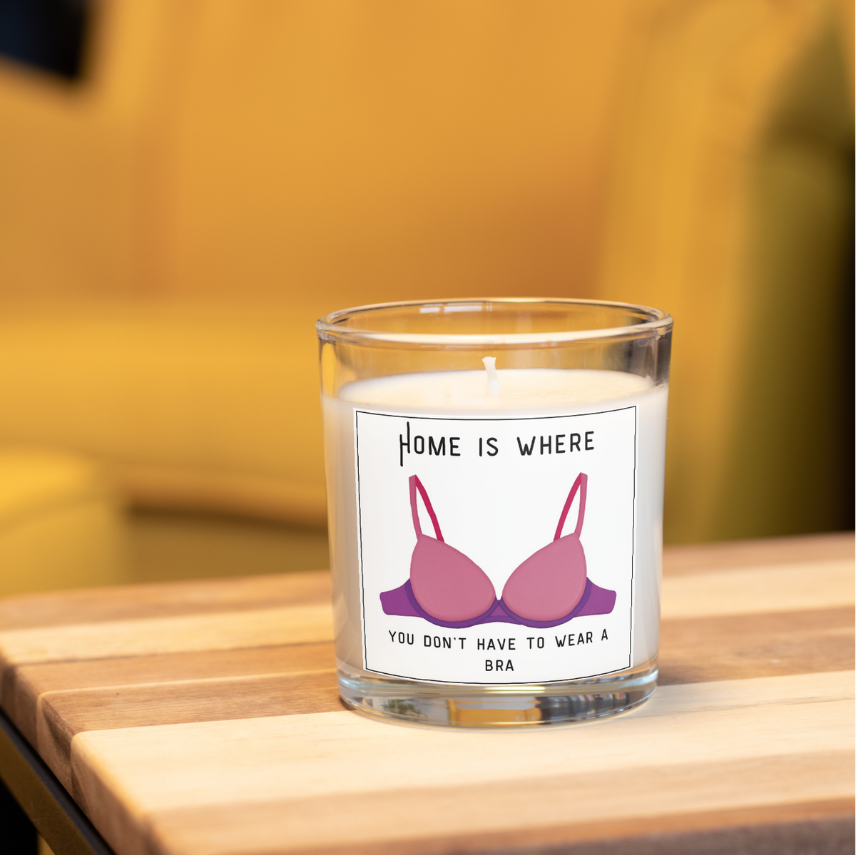 Funny new home candle with bra design in a home setting