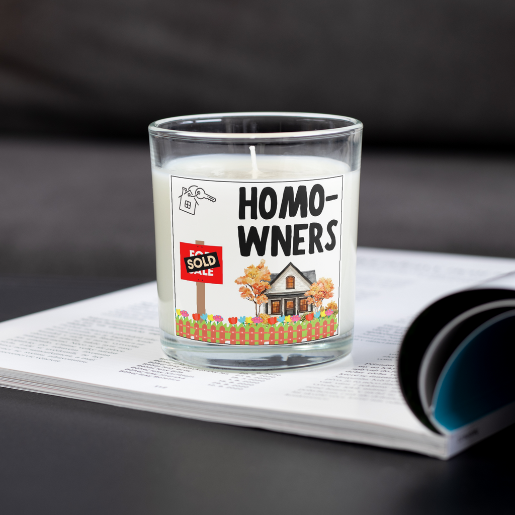 Homo-wners funny new home candle on an open magazine
