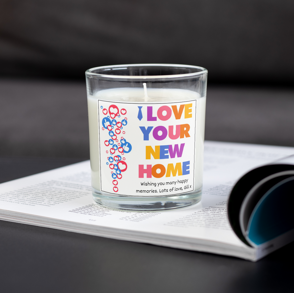 Personalised I Love Your New Home candle on an open magazine