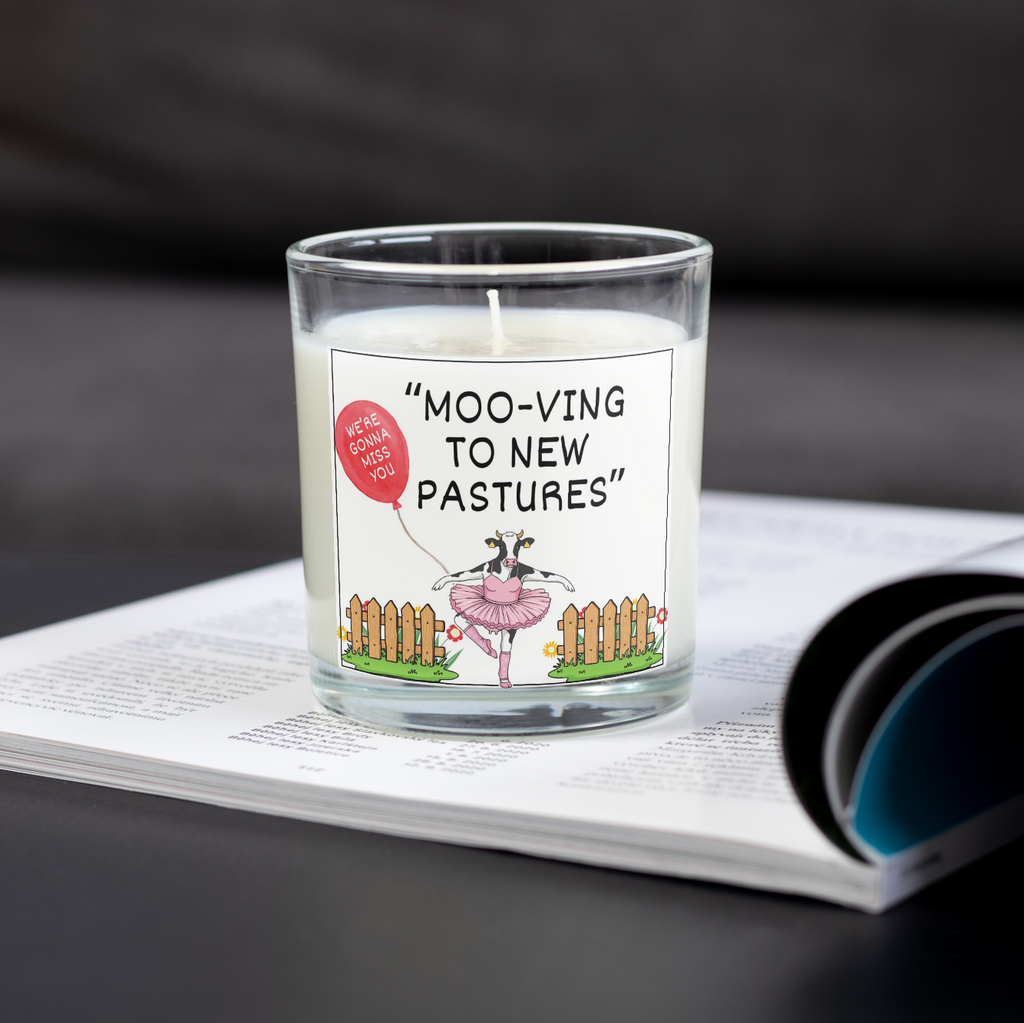 Personalised Moo-ving to New Pastures candle on an open magazine