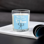 New Place To Bone skeleton new home candle on an open magazine
