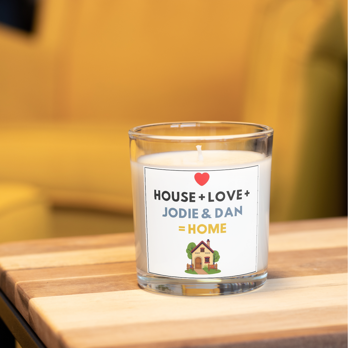 Personalised new home candle with House + Love + names design in a home setting