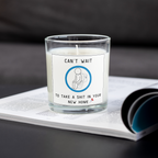 Rude new home candle with toilet joke design on an open magazine