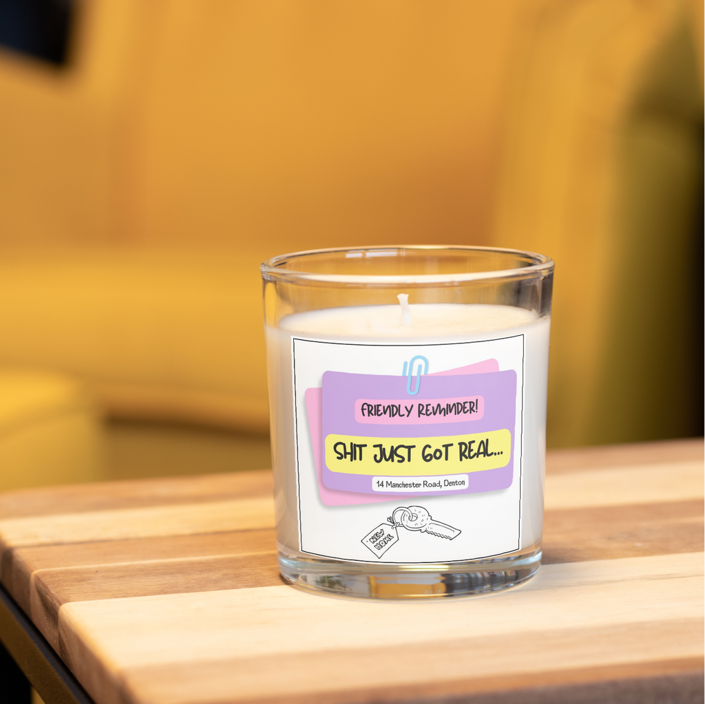Funny rude new home candle saying Shit Just Got Real in a home setting