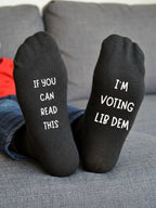 I’m Voting Lib Dem Socks – Custom Message Novelty Gift – sofa lifestyle view