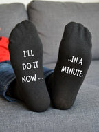 I’ll Do It Now in a Minute Socks – Funny Message Gift – sofa lifestyle view